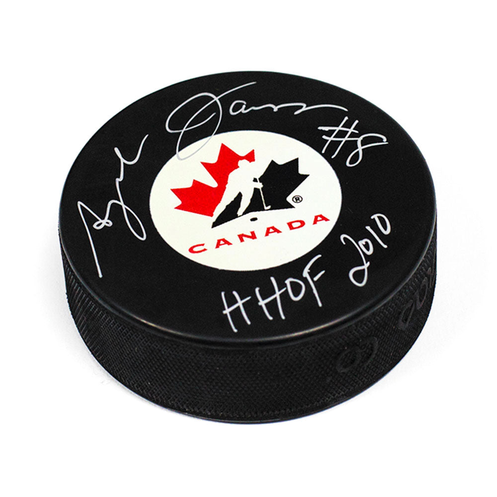 Angela James Team Canada Autographed Hockey Puck with HOF 2010 Inscription