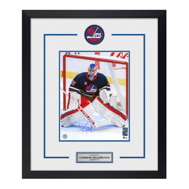 Connor Hellebuyck Signed Winnipeg Jets Heritage Puck Logo 23x27 Frame