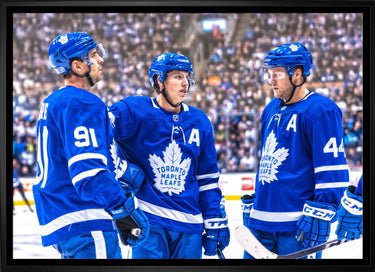 John Tavares, Mitch Marner and Morgan Rielly Toronto Maple Leafs Framed 20x29 Talking on Ice Canvas - Frameworth Sports Canada 